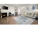 Inviting living room features a cozy fireplace, modern decor, and hardwood floors, perfect for relaxing and entertaining at 108 Berwick Crossing, Dallas, GA 30157