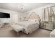 Elegant main bedroom with chandelier lighting, decorative touches, and a plush bed at 108 Berwick Crossing, Dallas, GA 30157