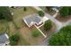 Aerial view of a home with a large yard, surrounded by lush greenery in a peaceful neighborhood at 25 Oakbrook Ln, Covington, GA 30016