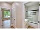 Bathroom featuring tile shower with glass door, and vanity at 25 Oakbrook Ln, Covington, GA 30016