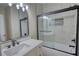Bright bathroom featuring vanity and tiled shower at 25 Oakbrook Ln, Covington, GA 30016