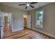 Bedroom featuring hardwood floors, neutral walls, closet and an exterior view at 25 Oakbrook Ln, Covington, GA 30016