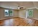 Spacious bedroom featuring hardwood floors, neutral walls, large windows, and a ceiling fan at 25 Oakbrook Ln, Covington, GA 30016