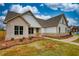 Charming home exterior with brick and siding, accentuated by manicured landscaping and a walkway at 25 Oakbrook Ln, Covington, GA 30016