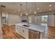 Open concept kitchen with island, pendant lights, and stainless appliances at 25 Oakbrook Ln, Covington, GA 30016