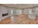 Spacious living room featuring hardwood floors, fireplace and access to the kitchen island at 25 Oakbrook Ln, Covington, GA 30016