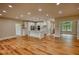 Spacious open-concept living area flows into the kitchen, highlighted by wood-look flooring at 25 Oakbrook Ln, Covington, GA 30016