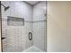 Modern tiled shower with glass door and black hardware at 25 Oakbrook Ln, Covington, GA 30016