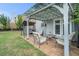 Relaxing backyard patio with a pergola, outdoor seating, and well-maintained landscaping for outdoor enjoyment at 3399 In Bloom Way, Auburn, GA 30011