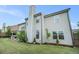 Spacious backyard with well-maintained lawn and partial view of the home's exterior at 3399 In Bloom Way, Auburn, GA 30011