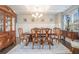 Formal dining room with elegant furniture, chandelier, and wainscoting at 3399 In Bloom Way, Auburn, GA 30011