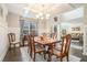 Sophisticated dining area featuring hardwood floors and natural light, perfect for entertaining at 3399 In Bloom Way, Auburn, GA 30011