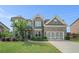 Beautiful two-story home with well-maintained landscaping, a two-car garage, and a welcoming front entrance at 3399 In Bloom Way, Auburn, GA 30011