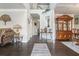 Inviting foyer with hardwood floors and elegant decor, showcasing the home's open floor plan at 3399 In Bloom Way, Auburn, GA 30011