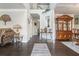 Elegant foyer with hardwood floors, staircase, and stylish decorations on display at 3399 In Bloom Way, Auburn, GA 30011