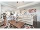 Open-concept living room and kitchen with hardwood floors and modern appliances at 3399 In Bloom Way, Auburn, GA 30011