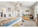 Spacious main bedroom featuring vaulted ceilings, sitting area, and carpeted floors at 3399 In Bloom Way, Auburn, GA 30011