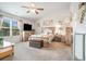 Spacious bedroom with large window, ceiling fan, neutral carpet and decorative artwork, creates a relaxing retreat at 3399 In Bloom Way, Auburn, GA 30011