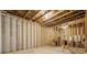 Unfinished basement with wooden studs creating a customizable space at 1606 Chancery Ln, Lithia Springs, GA 30122