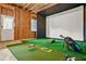 Basement features indoor golf simulator at 1606 Chancery Ln, Lithia Springs, GA 30122