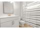 Bathroom featuring a sink, cabinet, and shower curtain at 1606 Chancery Ln, Lithia Springs, GA 30122