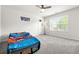 Bright bedroom with carpet floors and a window at 1606 Chancery Ln, Lithia Springs, GA 30122