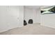 Finished bonus room perfect for an office or play area with neutral carpet at 1606 Chancery Ln, Lithia Springs, GA 30122