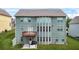 Back of home featuring a deck, covered patio, multiple windows, and lawn at 1606 Chancery Ln, Lithia Springs, GA 30122