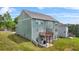 Rear view of the home showcasing the multi-level deck and manicured lawn at 1606 Chancery Ln, Lithia Springs, GA 30122