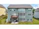 Three-story house with back deck and well-maintained lawn at 1606 Chancery Ln, Lithia Springs, GA 30122