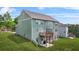 Three-story home with a back deck and well-maintained lawn at 1606 Chancery Ln, Lithia Springs, GA 30122