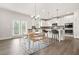 Open kitchen and breakfast nook, featuring stainless steel appliances and a light-filled breakfast area at 1606 Chancery Ln, Lithia Springs, GA 30122