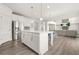 Bright, open kitchen with stainless steel appliances and a large island at 1606 Chancery Ln, Lithia Springs, GA 30122