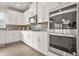 Gourmet kitchen with stainless steel appliances, tiled backsplash, and ample counter space at 1606 Chancery Ln, Lithia Springs, GA 30122