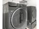 Modern laundry room with gray washer and dryer at 1606 Chancery Ln, Lithia Springs, GA 30122