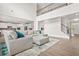 Open-concept living room with soaring ceilings, a view of the kitchen, and a comfortable seating area at 1606 Chancery Ln, Lithia Springs, GA 30122