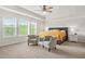 Spacious main bedroom with natural light, tray ceiling and carpet at 1606 Chancery Ln, Lithia Springs, GA 30122