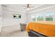 Main bedroom with TV, carpet, and natural light at 1606 Chancery Ln, Lithia Springs, GA 30122