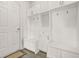 Organized mudroom with built-in storage lockers, bench seating, and hooks at 1606 Chancery Ln, Lithia Springs, GA 30122
