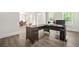 Spacious home office with a large L-shaped desk, two monitors, and ample room for productivity at 1606 Chancery Ln, Lithia Springs, GA 30122