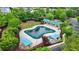 Aerial view of a community pool, complete with shaded seating and landscaping at 1606 Chancery Ln, Lithia Springs, GA 30122