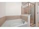 Bathroom features a soaking tub and a separate glass-enclosed shower with a built-in bench at 2061 Grove Field Lane #13, Marietta, GA 30064