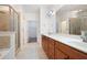 Bathroom boasts double sinks, a glass-enclosed shower, and access to the walk-in closet at 2061 Grove Field Lane #13, Marietta, GA 30064