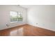 Bedroom features hardwood floors and a window with natural light at 2061 Grove Field Lane #13, Marietta, GA 30064