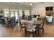 Community dining hall featuring tables, chairs, and a cozy fireplace at 2061 Grove Field Lane #13, Marietta, GA 30064