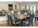 Community dining room with multiple tables and chairs, fireplace, and windows at 2061 Grove Field Lane #13, Marietta, GA 30064