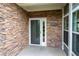 Close-up view of the home's entrance with stone wall and address number 2061 at 2061 Grove Field Lane #13, Marietta, GA 30064