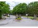 Gated community entrance with stone pillars, iron gate, and well-maintained landscaping at 2061 Grove Field Lane #13, Marietta, GA 30064