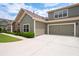 Charming home featuring a two-car garage, manicured landscaping, and a welcoming exterior at 2061 Grove Field Lane #13, Marietta, GA 30064