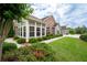 Home exterior featuring gray siding, stone accents, multiple windows, and a nicely landscaped yard at 2061 Grove Field Lane #13, Marietta, GA 30064